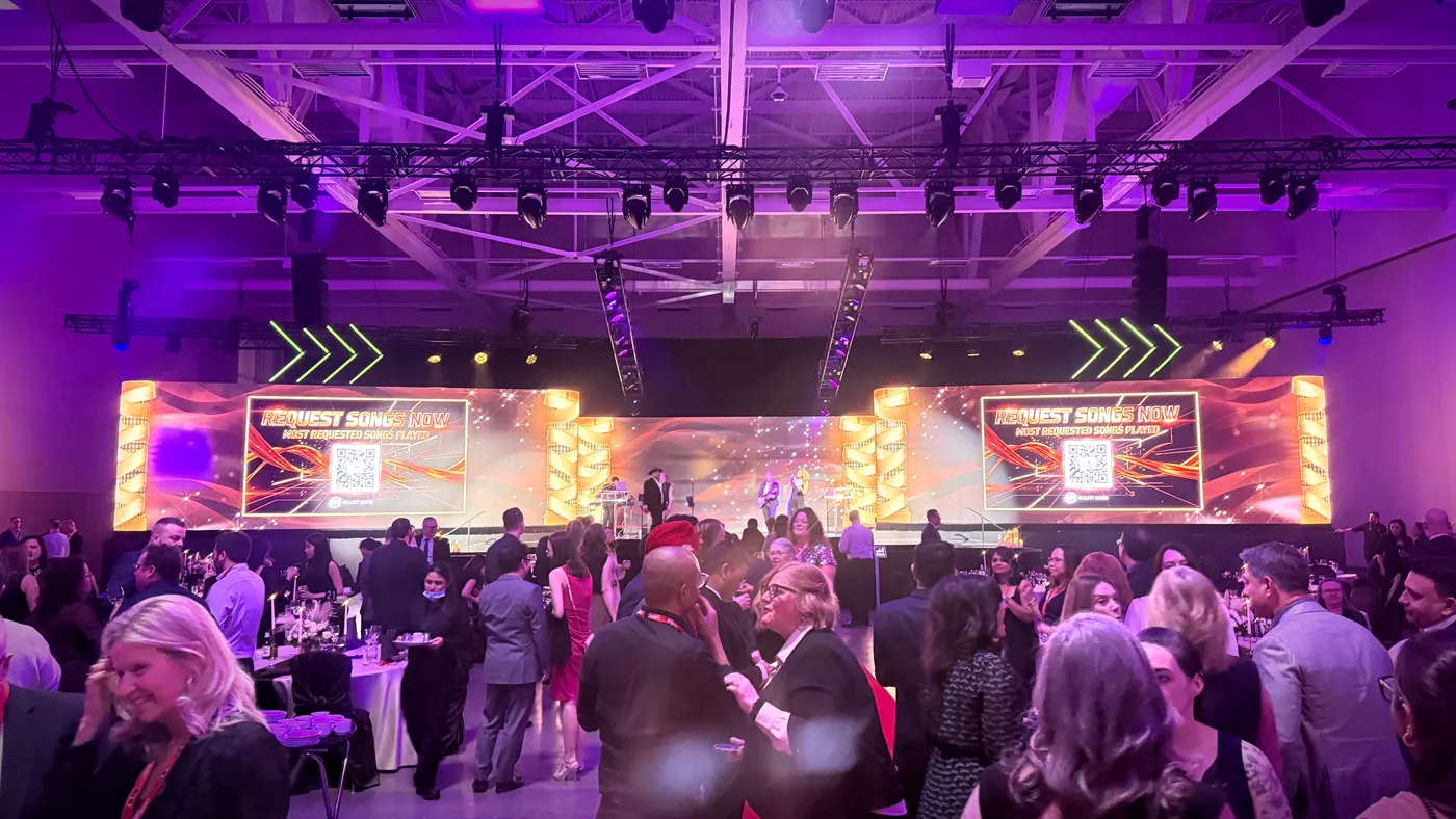Packed corporate gala in Toronto with twin Request Songs Now screens above the uRequest Live stage